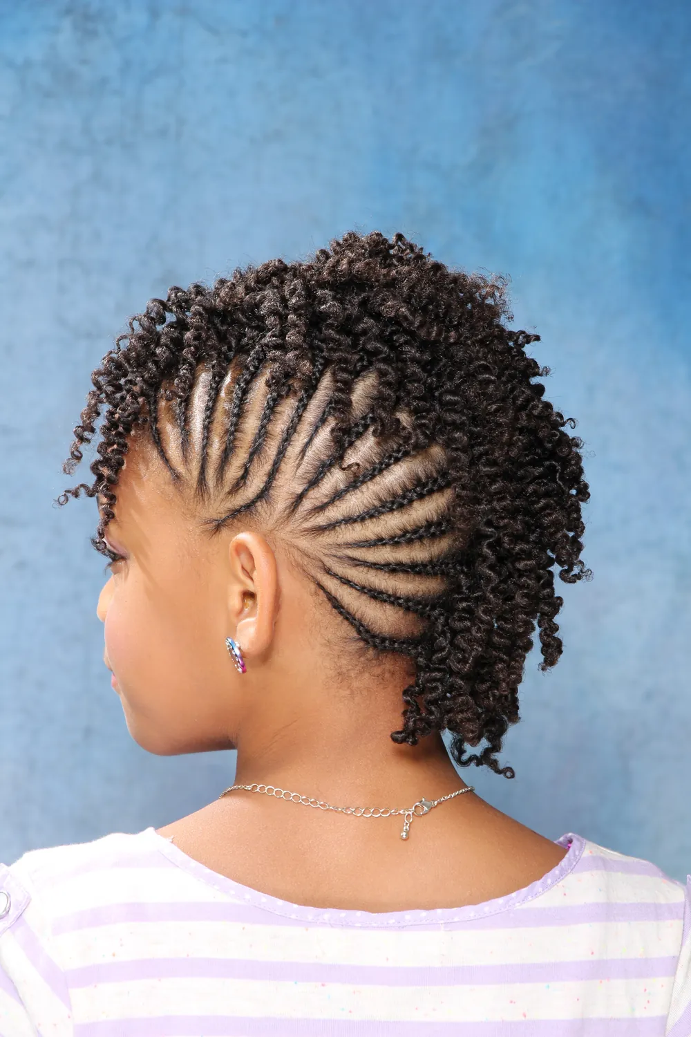 Back view of a client's twists showing a neat cornrow pattern at the side