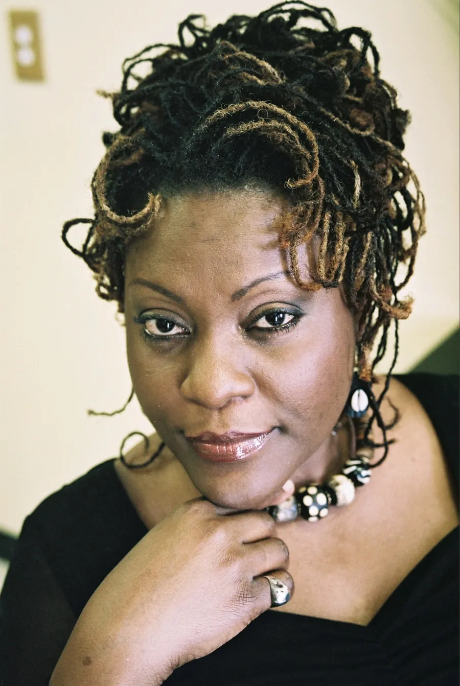 Stephon, owner of StephStyles, wearing her own locs styled up